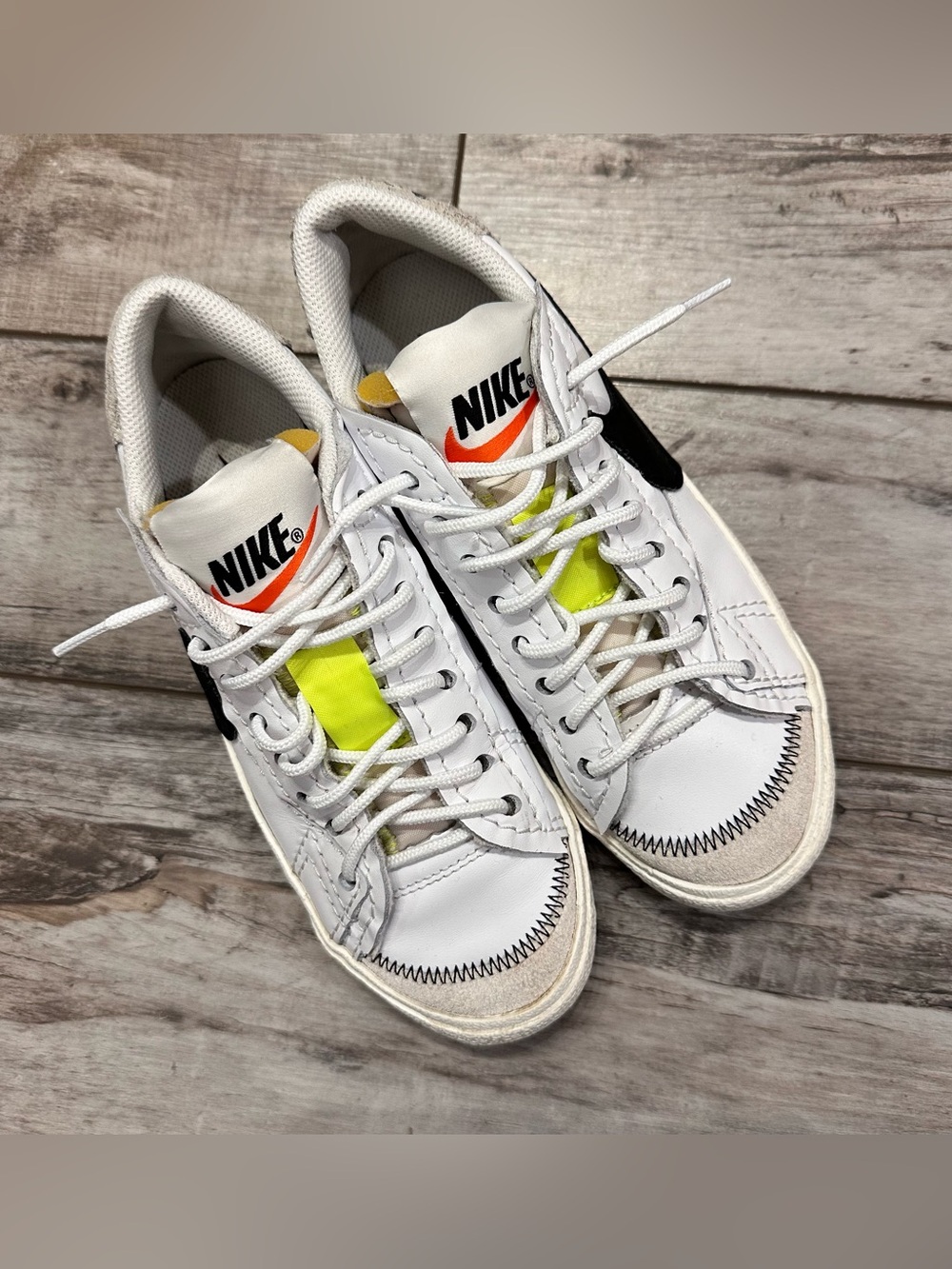 Nike White Leather Low-Top Sneakers with Neon Yellow Tongue and Black Swoosh